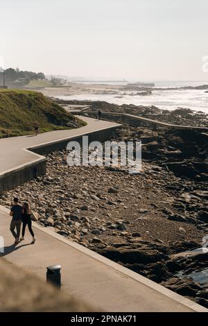 Porto Homem do Leme Beach Picturesque View with Walking People on a Sunny Blue Sky Day, portugal - sep 2022. High quality photo Stock Photo