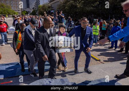 NASHVILLE, TENNESSEE - APRIL 17: Gun safety advocates and faith leaders carry empty caskets symbolizing victims to the Tennessee Capitol for a ?'Moral Monday?'? rally to address gun violence on April 17, 2023 in Nashville, Tennessee. In the wake of the March shooting at The Covenant School, in the Green Hills neighborhood of Nashville, organizations have mobilized around U.S. Rep ?Justin Jones? (?D-Nashville?), and ?U.S. Rep ?Justin J. Pearson? (??D-Memphis?)? ?who ?have drawn? ?national attention? ?pushing for gun safety laws. (Photo by Michael Nigro/Sipa USA) Stock Photo