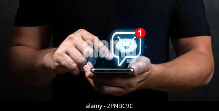 Hand using smartphone and chatting with chat bot, Chat with AI or Artificial Intelligence technology. AI, Artificial Intelligence, digital software te Stock Photo