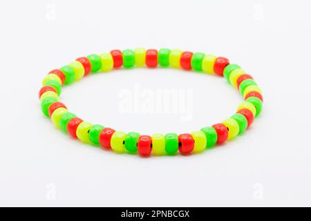 bracelets with plastic beads in red, green and yellow Stock Photo