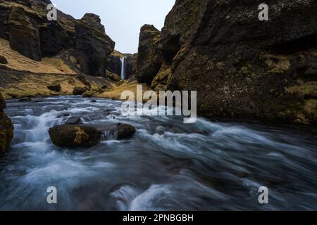 Scenic view of Seljalandsfoss waterfall flowing down rocks in mountainous woods in Iceland Stock Photo