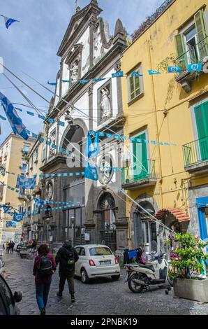 Naples, Italy - April 2, 2023:  View of the Chiesa del Gesu della Monache with flags and bunting celebrating the success of the Naples football team o Stock Photo
