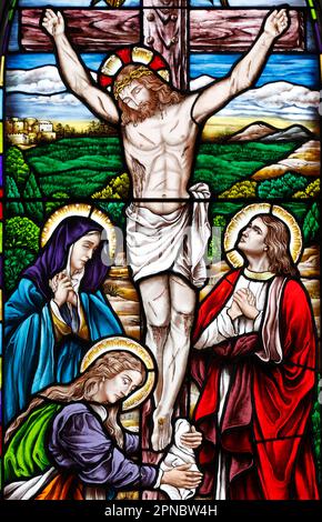 Song Vinh Church. Stained glass.  The crucifixion. Jesus on the Cross Vietnam. Stock Photo