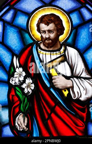 Song Vinh Church. Stained glass.  Saint Joseph the carpenter.  Vietnam. Stock Photo