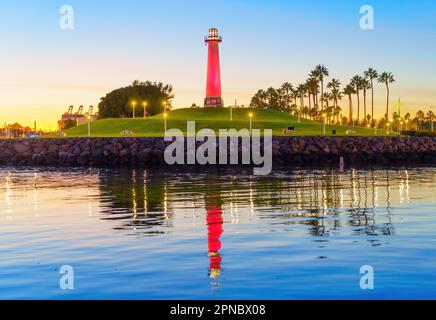 Beautiful view of the Long Beach Lighthouse in California during a stunning sunset, as seen from the water. Stock Photo