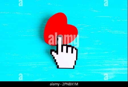 Plastic pointer cursor touches a white screen smartphone isolated on a ...