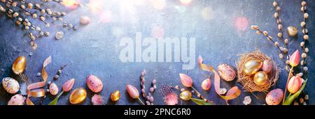 Easter - Eggs In Nest And Tulips With Golden And Pink Decorations On Blue Table With Sunshine Stock Photo