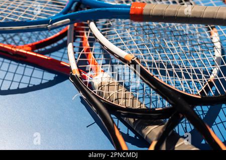 broken tennis rackets on clay tennis court Stock Photo