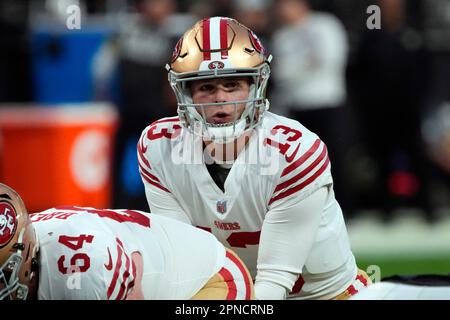 FILE - San Francisco 49ers quarterback Steve Young upends Dallas