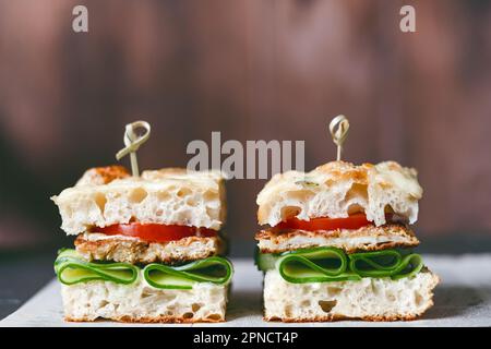 Genoese focaccia flatbread with filling on the table. Appetizing snack. Homemade healthy food Stock Photo