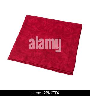 Folded red decorated tissue napkin isolated over white background. Stock Photo