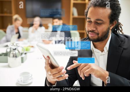 Business man typing sms or messenger message with popped up speech bubbles in conference room Stock Photo