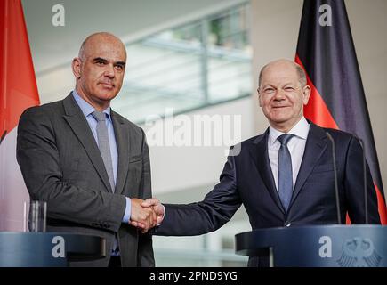 German Chancellor Olaf Scholz, right, shakes hands with Turkish ...