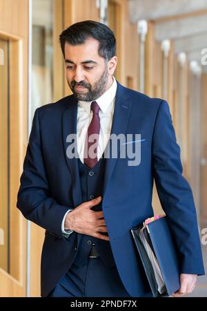 First Minister Humza Yousaf arrives to deliver a statement on 'Our Priorities for Scotland', in the main chamber of the Scottish Parliament in Edinburgh. Picture date: Tuesday April 18, 2023. Stock Photo