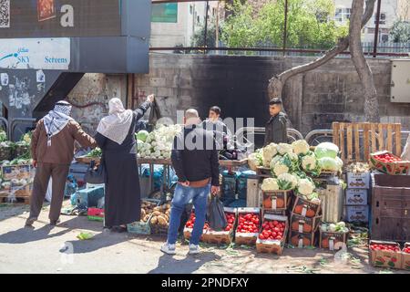 Palestinians buying groceries at an outdoor market in Hebron, West Bank, Palestine Stock Photo