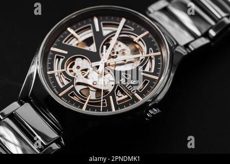 Lengnau, Switzerland - November 11, 2021: Luxury Swiss made skeleton mechanical wrist watch with black deal and body made of black ceramics. Rado True Stock Photo