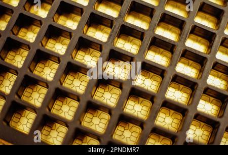Looking down on a tray of SIM card chips Stock Photo