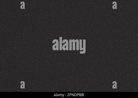 Black synthetic fabric texture, closeup detail individual threads visible Stock Photo
