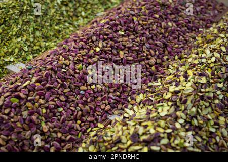Piles of pistachio nuts for sale on food market Stock Photo