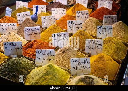 Colorful spices with arabic description tags on Souq in Damascus Stock Photo