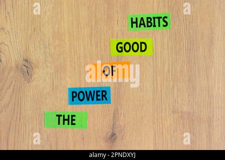 The power of good habits symbol. Concept words The power of good habits on colored paper. Beautiful wooden table wooden background. Business the power Stock Photo