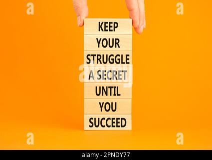 Keep secret symbol. Concept words Keep your struggle a secret until you succeed on wooden blocks. Beautiful orange background. Copy space. Businessman Stock Photo