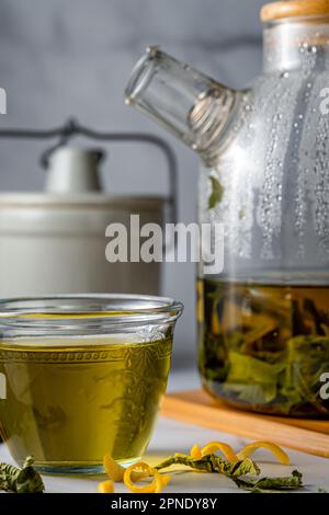 Infused green tea with herbs. Portrait format. Stock Photo