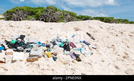 Global ecological problem with plastic waste washed up on beaches. Environmental pollution concept. Stock Photo