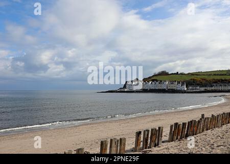 Wooden groynes on the beach at Cushendun in Northern Ireland Stock Photo