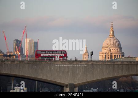 London Red Bus on Waterloo Bridge with St. Pauls cathedral in the background Stock Photo