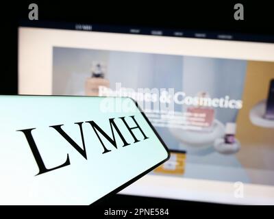 LVMH company logo on a website with blurry stock market