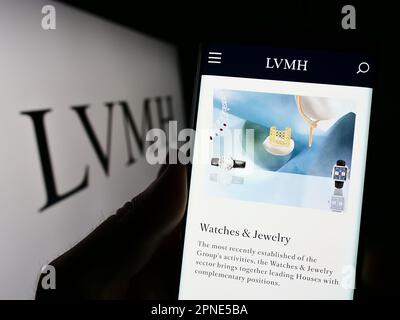 Person Holding Mobile Phone with Logo of Company LVMH Moet Hennessy Louis  Vuitton SE on Screen in Front of Web Page. Editorial Photo - Image of  chandon, illustrative: 279716531