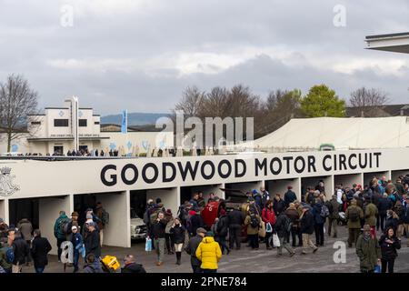 April 2023 - People enjoying the cars in the paddock at the 80th Goodwood Members Meeting. Stock Photo