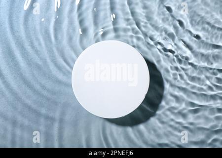 Plaster podium in water on grey background Stock Photo