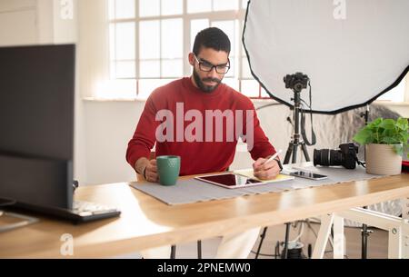 Creative graphic designer working on project at office Stock Photo