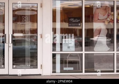 Lower Paxton, United States. 18th Apr, 2023. A 'we're hiring' sign is seen in the window of a David's Bridal shop on April 18, 2023, near Harrisburg, Pa. David's Bridal. LLC announced on Monday, April 17, 2023, that it filed for protection under Chapter 11 of the U.S. Bankruptcy Code.The announce ment comes just days after the company announced it would lay off more than 9,200 employees. (Photo by Paul Weaver/Sipa USA) Credit: Sipa USA/Alamy Live News Stock Photo