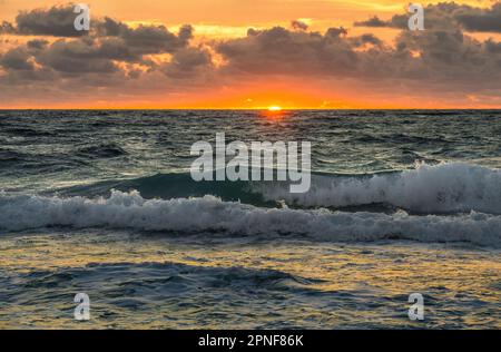 Dramatic sky at sunset over sea Stock Photo