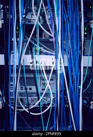 Tangled computer cables in server room Stock Photo