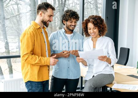 Teamwork, collaboration concept. Group of multiracial business team gathered in boardroom, businesspeople discuss new project, financial statistics, promotion strategy, financial risks and profits Stock Photo