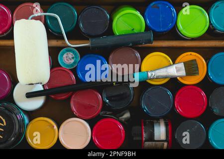 high angle view of acrylics and other elements of a painter artist. Art workshop. Stock Photo