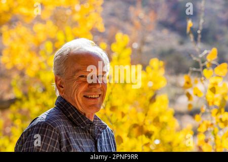 Senior man smiling and posing in Zion National Park Stock Photo