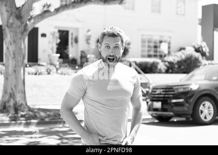 surprised man outdoor. happy bearded man with shocked face. mature guy express happiness. surprise about good news. positive feelings and emotions. Stock Photo