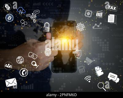 A hand touching or activating a smartphone screen with many internet related icons flying out of it, online use, and internet of things technology Stock Photo