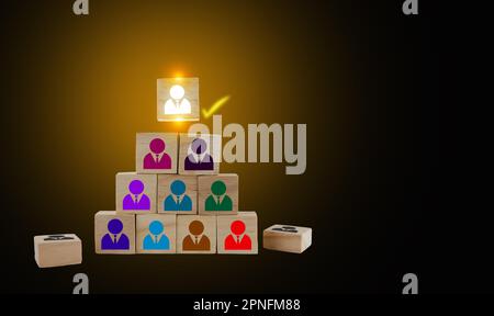 Wooden blocks with people icons, putting the right man into the right position, HR concept, recruitment, human resources and management Stock Photo