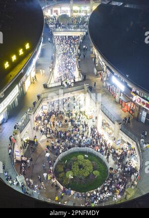 Aerial photo shows people shopping in the largest night market in