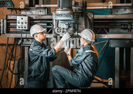 Engineering technicians use various hand tools and equipment to perform regular maintenance by inspecting, testing, and repairing machinery and engine Stock Photo