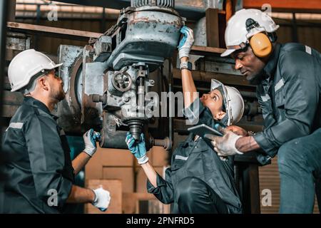 Engineering technicians use various hand tools and equipment to perform regular maintenance by inspecting, testing, and repairing machinery and engine Stock Photo