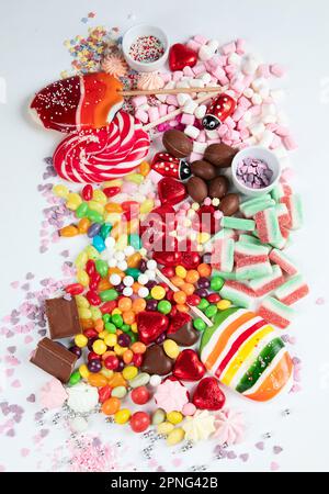 Assortment of colorful candy on a white background. Top view. Stock Photo