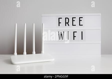 White router and lightbox with free wifi text Stock Photo