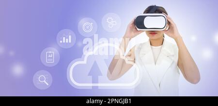 Young asian woman wearing VR glasses accessing the cloud computing technology internet storage network, a large database big data through internet tec Stock Photo